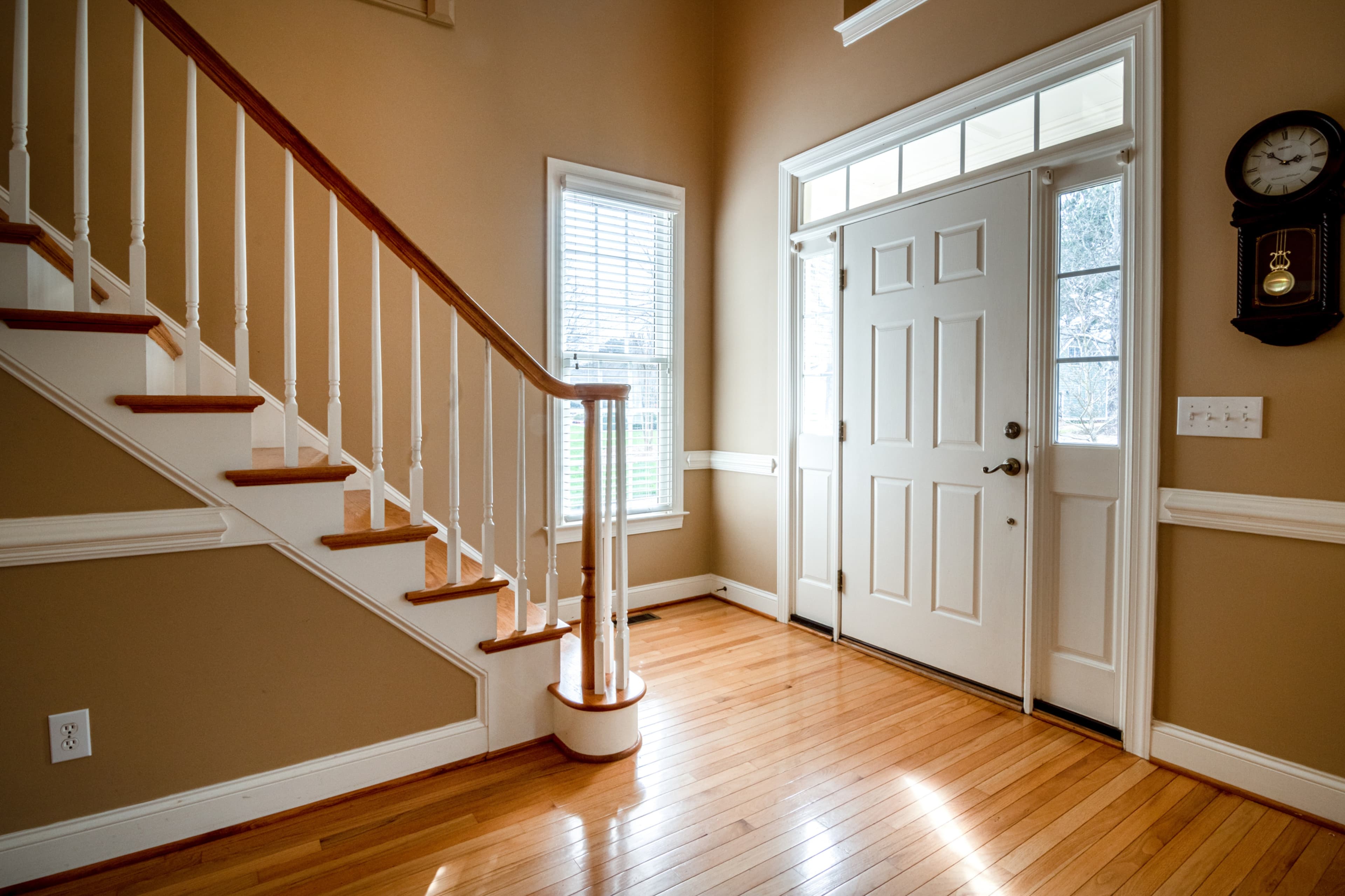 A white door next to a stairs